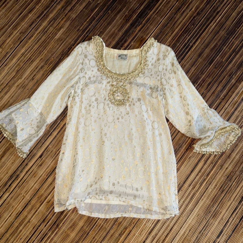 Ivory and gold top.